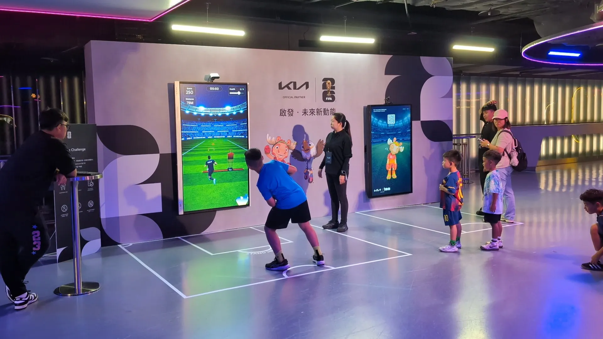 A player leans hard to one side to steer past an obstacle while children waiting their turn look on